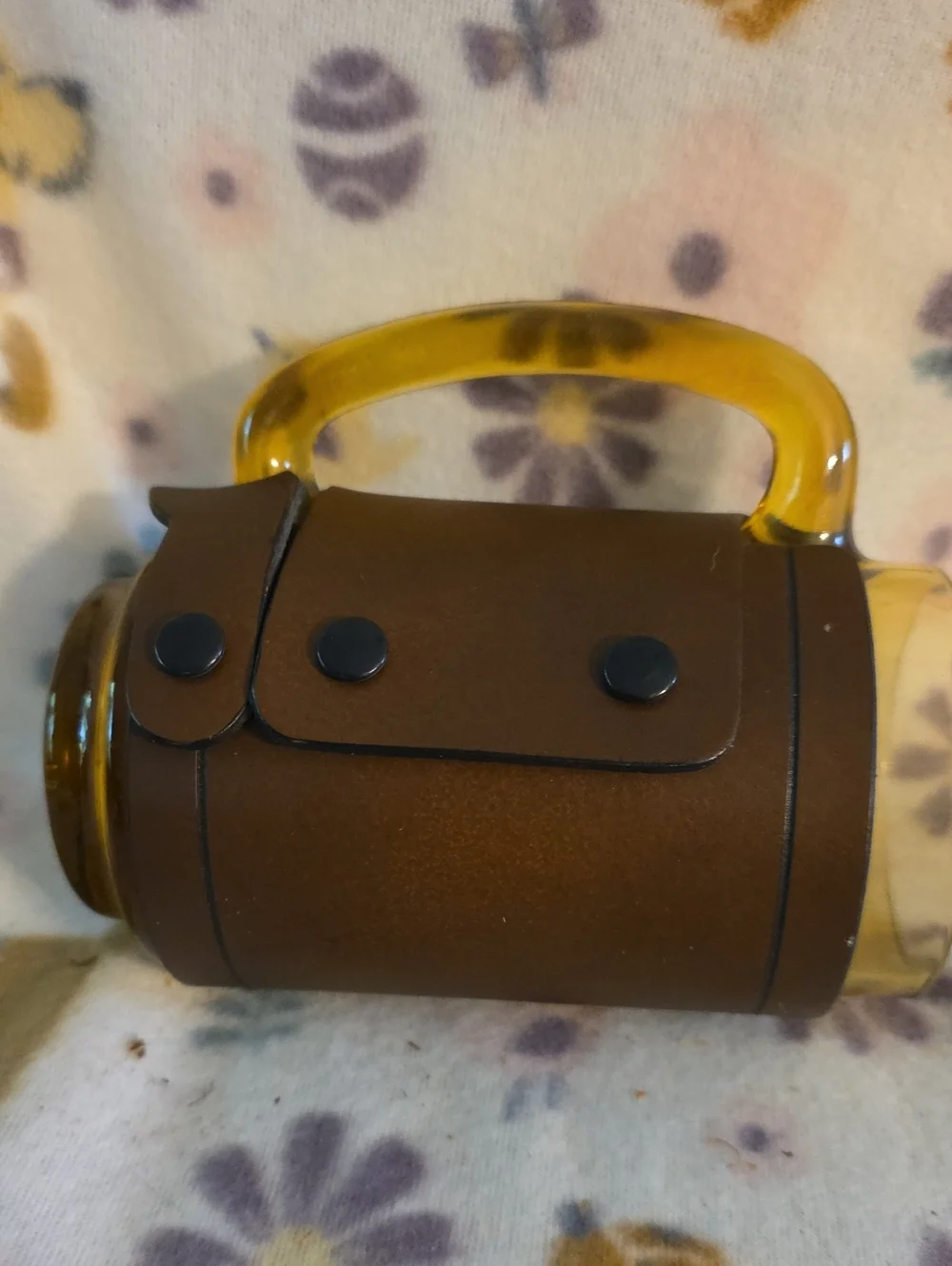 Vintage amber glass beer mug featuring a fitted brown leather wrap